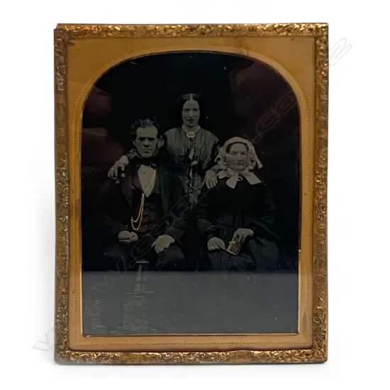 Gilt framed and matted ambrotype - Two women and man with gilded jewellery. 11 x 8.5mm.